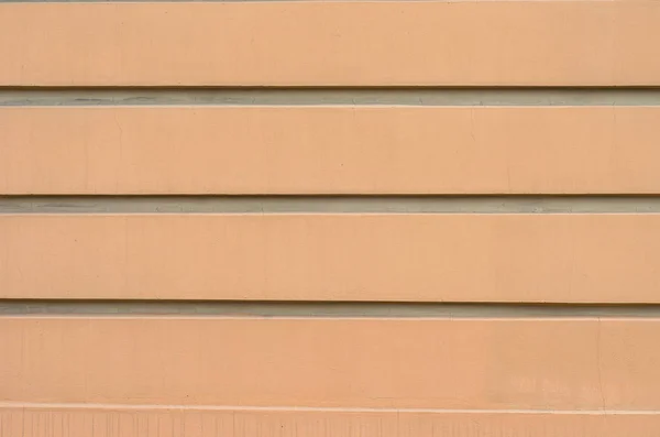 relief striped stucco facade of the building in the classical style