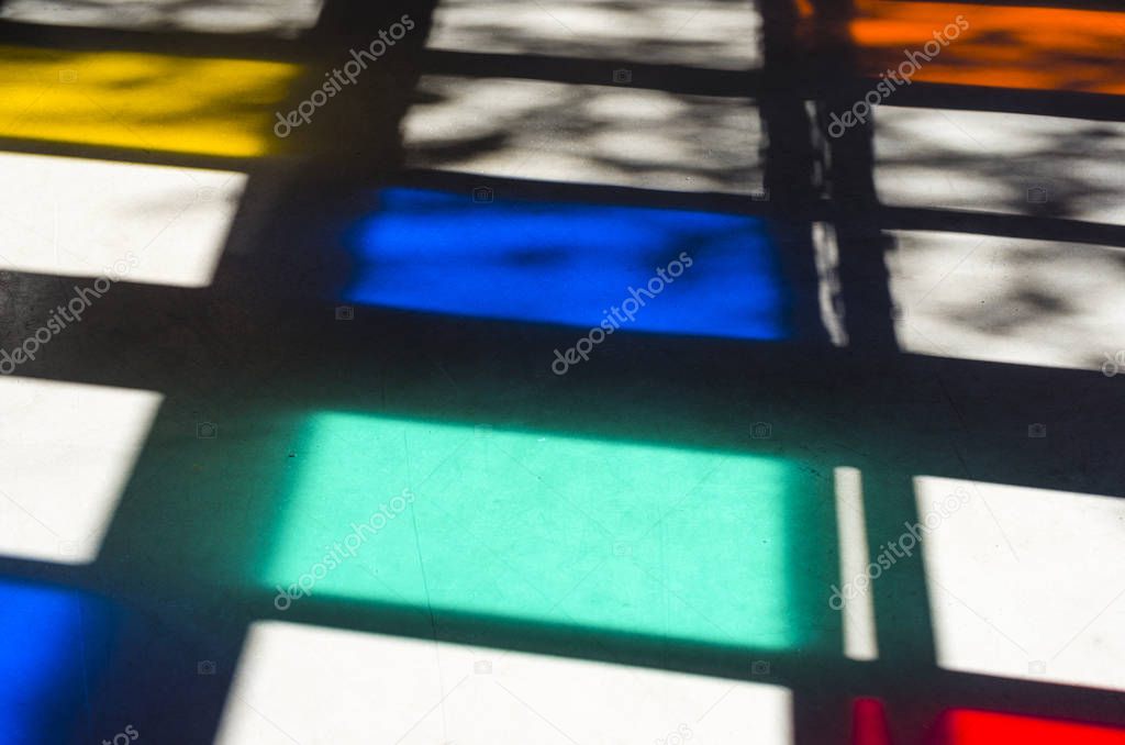 colored stained-glass windows illuminated by the sun's rays