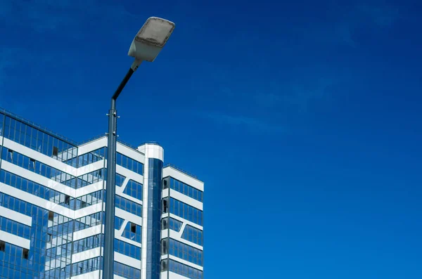 A modern street LED lighting pole. Urban electro-energy technologies. Savings on street urban road lighting. Energy saving. High tech. Eco-friendly smart city system.