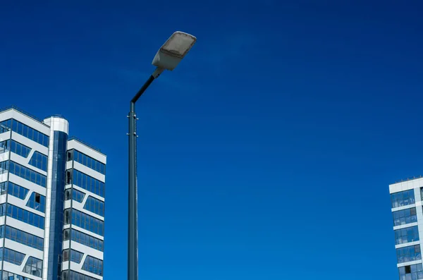 A modern street LED lighting pole. Urban electro-energy technologies. Savings on street urban road lighting. Energy saving. High tech. Eco-friendly smart city system.