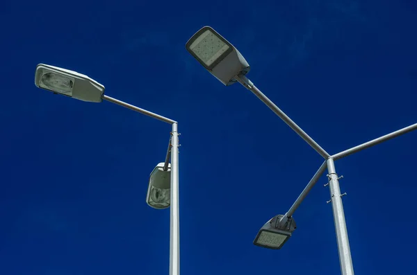 A modern street LED lighting pole. Urban electro-energy technologies. Savings on street urban road lighting. Energy saving. High tech. Eco-friendly smart city system.