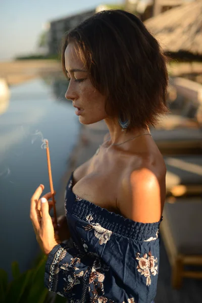 Beautiful woman with short brunette hair posing with close eyes — Stock Photo, Image