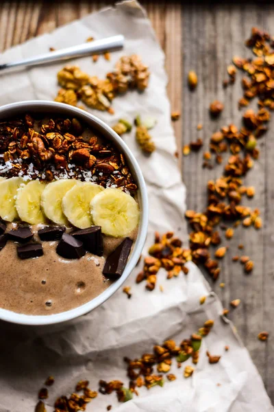 asty breakfast from chocolate smoothie bowl topping with banana,