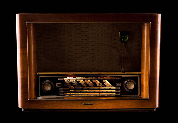 Old radio on a black background