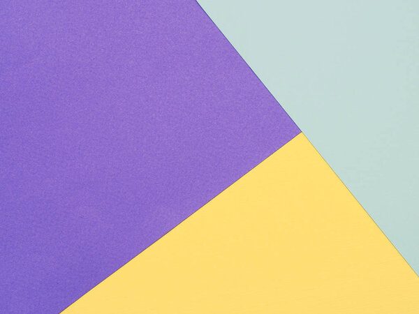 abstract geometric background of lilac yellow and blue sheets of watercolor paper