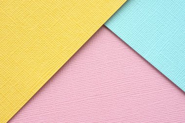 soyut arka plan. sarı pembe ve mavi rengin çok renkli dokulu kağıt rasgele bulunur