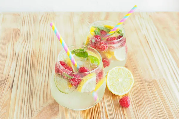 Two Misted Glasses Ice Lemonade Lemon Lime Raspberry Mint Soda — Stock Photo, Image