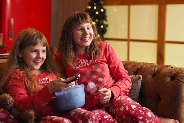 Two Teenage Girls Loose Hair Red Pajamas Watching Movie Laughing — Stock Photo, Image