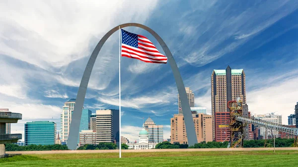 Huge American flack and St Louis skyline with capital and famous