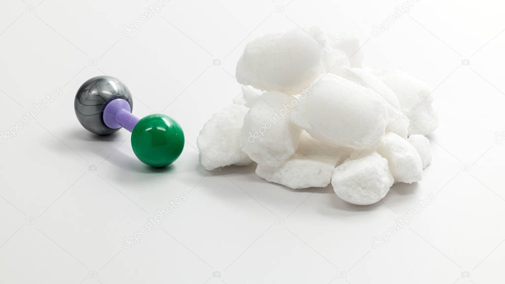 Sodium Chloride molecule and a pile of salt crystals
