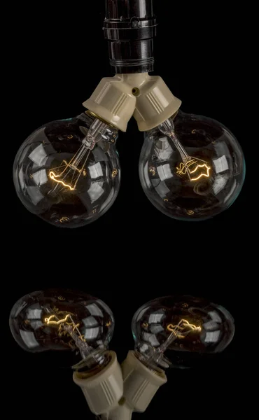 Fancy light bulbs handing with reflection