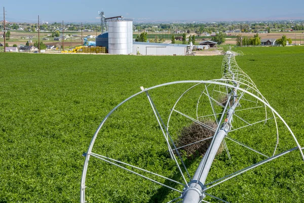 Farm field and rolling sprinklers — Stock Photo, Image