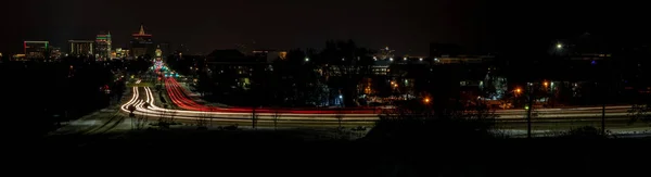 Classic car lights streak through Boise — Stock Photo, Image