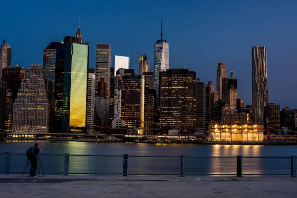 New York skyline at night with photographer