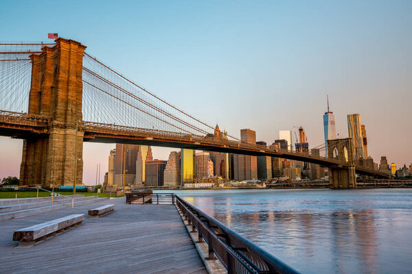 Sunrise on the New York city skyline with bridge