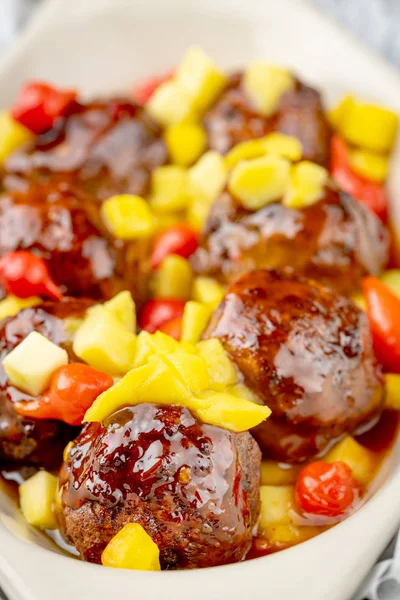 hors d\'oeuvresof meatballs with colorful peppers servers as an a