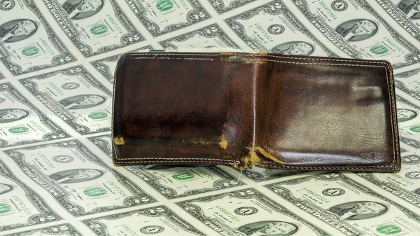 Leather wallet on many bills of money — Stock Photo, Image