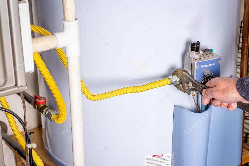 Wrench on a gas line for a hot water heater