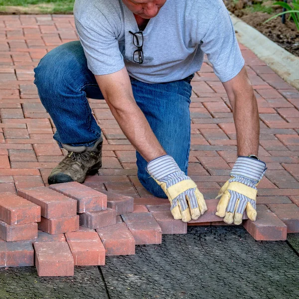 Brick walkway is build on at a time