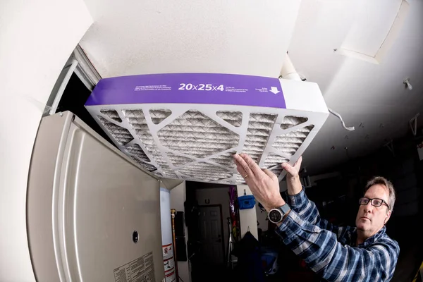 Furnace air filter replacement with a clean one