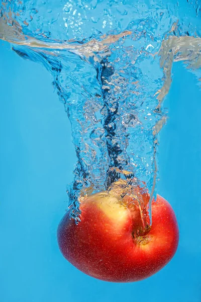 Fresh Apple Drops Water Splash Blue Background Royalty Free Stock Photos