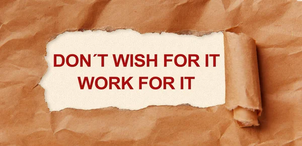 Don t wish for it, Work for it - appearing behind torn brown paper