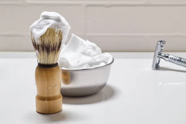 shaving set with blade, brush and bowl with foam