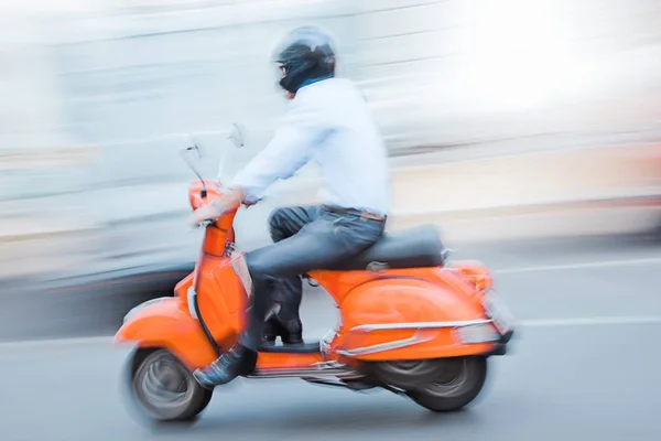 Easy going formal biker - panning Stock Photo