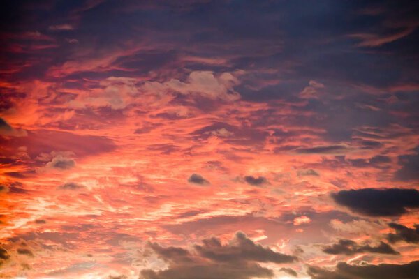 Dramatic sky in orange color. Sunset in the heaven - natural background