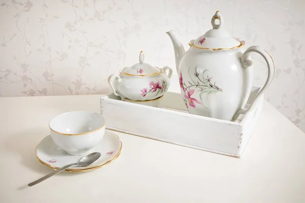 White tea service on white commode ready for use. Start a morning with cup of tea or coffee.