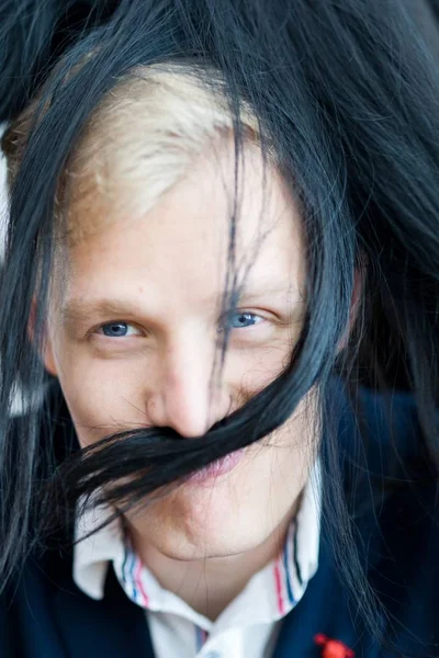 Blond man in formal dress - fake mustache and hairs from girlfriend\'s hairs.