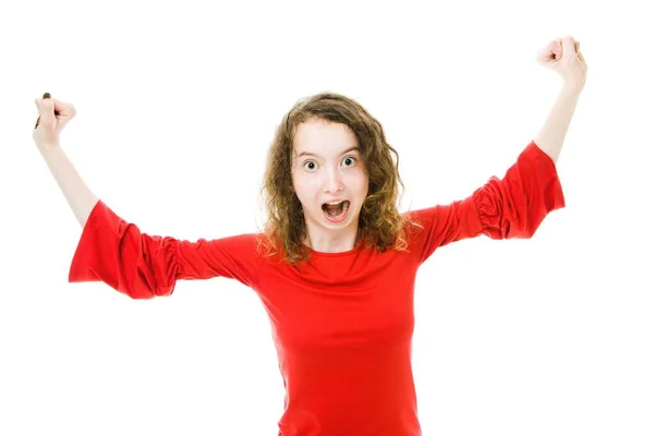 Excited girl in red rising up hands — Stock Photo, Image