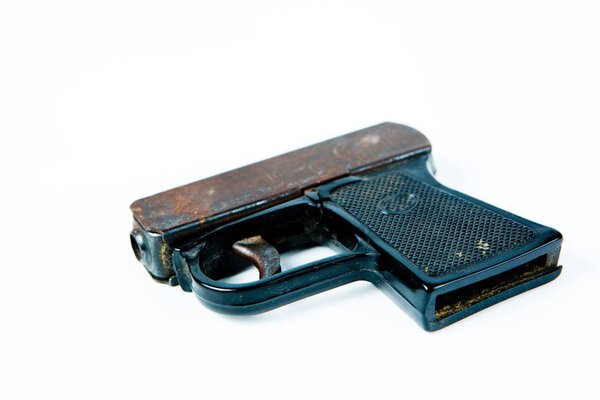 Old rusty starting pistol with black plastic grip