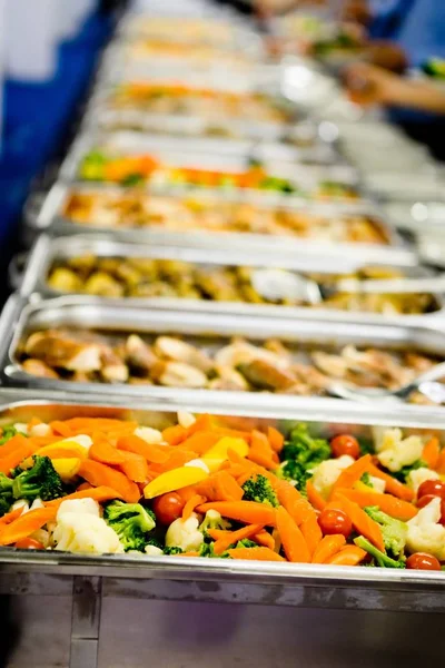 Steamed vegetables in professional warm catering.