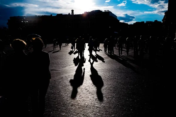 Silhouettes of people walking on the streets. Stock Picture