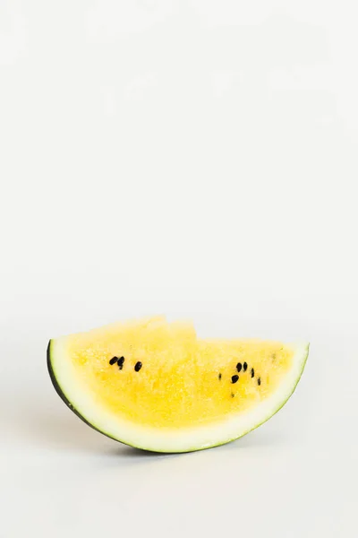 Cut a slice of ripe yellow melon on a white background — Stock Photo, Image