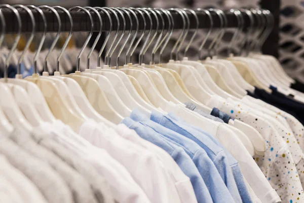 The clothes hanger is Filled with colorful Fabric shirts — Stock Photo, Image