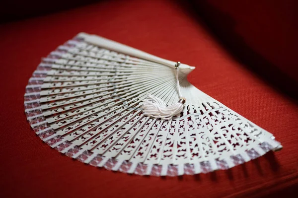 white hand fan ideal for weddings