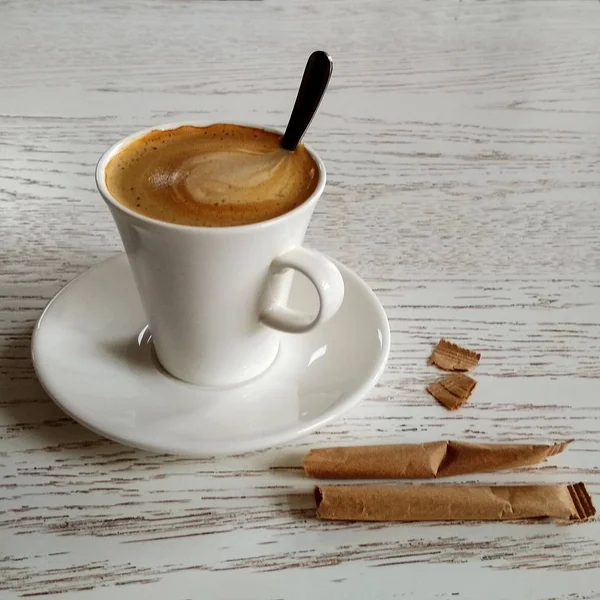 Coffee with milk on the white table — Stock Photo, Image