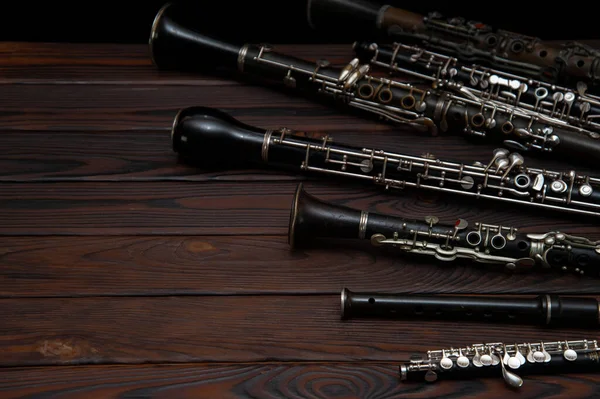 Woodwind Instruments Lie Wooden Surface — Stock Photo, Image