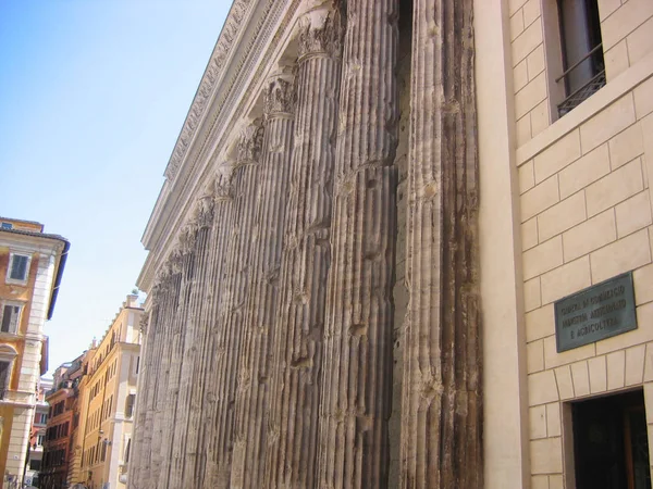 Antique columns harmoniously fit into modern architecture, Rome, Italy, Europe