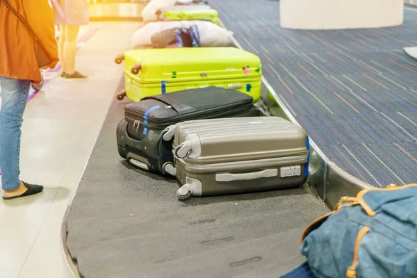 Suitcase or luggage with conveyor belt in the airport.