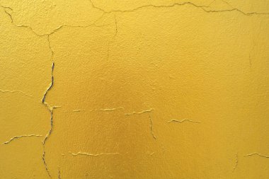 Altın duvar dokusu ile çimento arka plan.