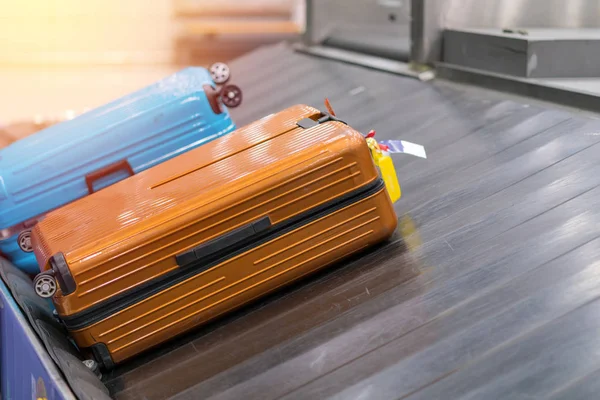 Suitcase or luggage with conveyor belt in the airport.