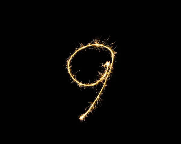 Numbers 9 or nine Sparkler firework light isolated on black back — Stock Photo, Image