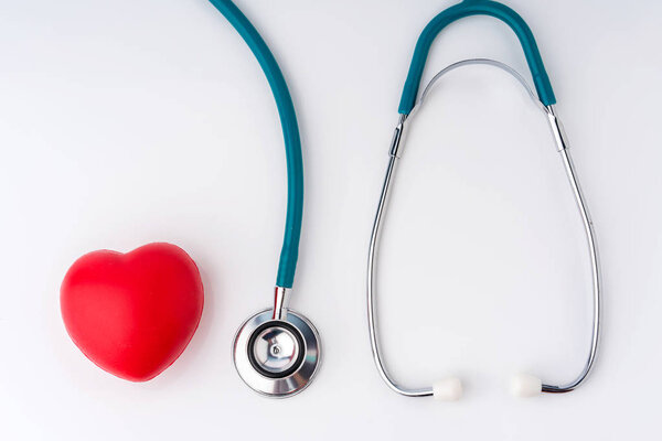 Red heart and stethoscope for doctor and medical nursing people check up healing of patients in hospital.