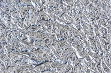 Parlak metal gümüş folyo dokusu ve artalan için düzensiz yüzey