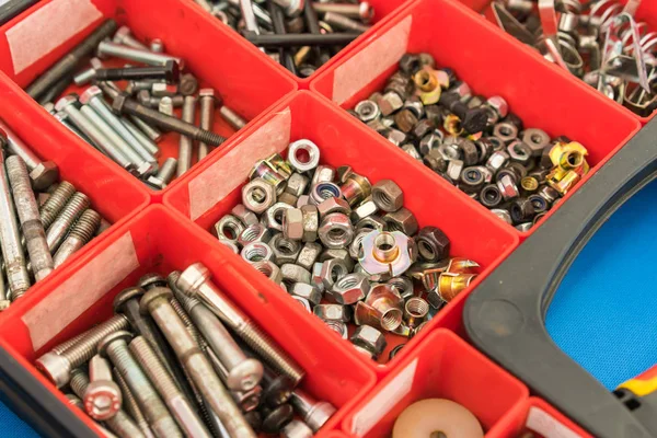 Different Nuts Screws bolts and other Parts sorted in box — Stock Photo, Image