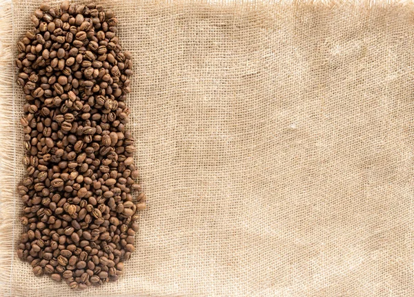Heap Coffee Beans Lay Sackcloth Top View — Stock Photo, Image