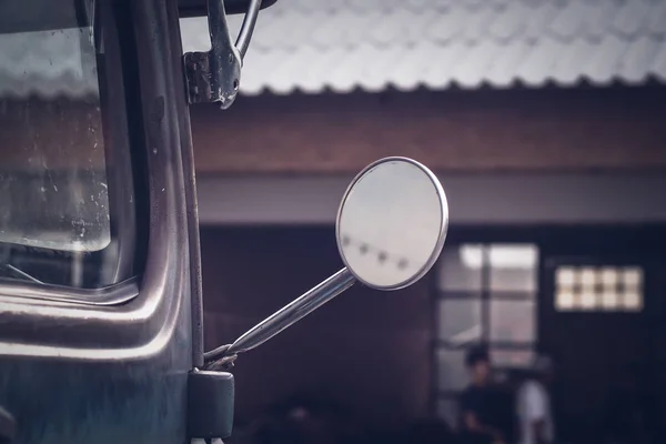 Close-up of a driving mirror on a vintage vehicle.old warehouse blur background — Stock Photo, Image